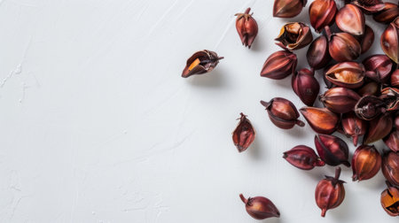 Various colorful flowers arranged in a bunch are resting on a wooden table, creating a vibrant and inviting display.の素材