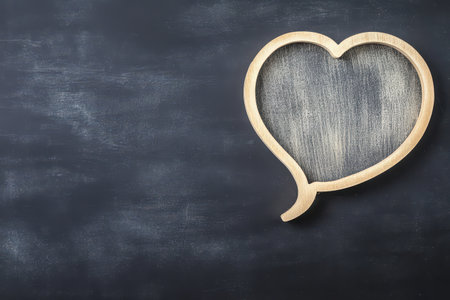 Heart shaped frame on dark slate backgroundの写真素材