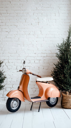 A retro orange scooter stands against a white brick wall surrounded by small festive Christmas trees evoking a cozy New Year atmosphere.の素材