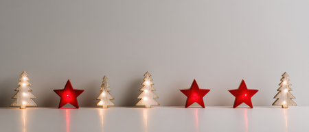 Festive red stars and white trees are arranged beautifully glowing softly in the studio lighting celebrating the joy of the New Year season.の素材