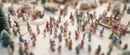 A colorful collection of tiny characters celebrate Christmas and New Year in a charming winter village capturing the magic of the festive season.の素材