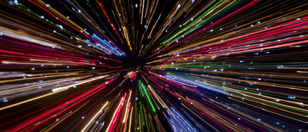 Vibrant streaks of light burst forth celebrating the New Year with cosmic fireworks in the vastness of the universe during a space voyage.の素材