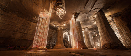 Cavernous space adorned with glowing lights creates a festive atmosphere for New Year celebrations. Shadows dance across the textured stone.の素材