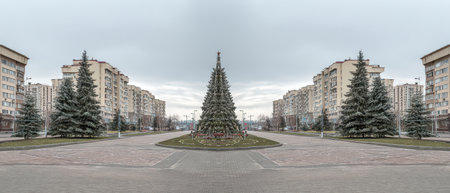 Tall buildings surround a central Christmas tree as city dwellers prepare to welcome the New Year with joy and celebration in the air.の素材