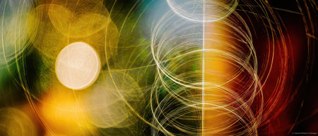 Colorful lights swirl and dance creating an abstract scene that captures the excitement of New Year celebrations.の素材