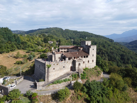 Lusuolo, MC, Italy - 08, 08, 2024. Aerial drone view of Castello di Lusuolo in the Lunigiana hills, Tuscanyのeditorial素材