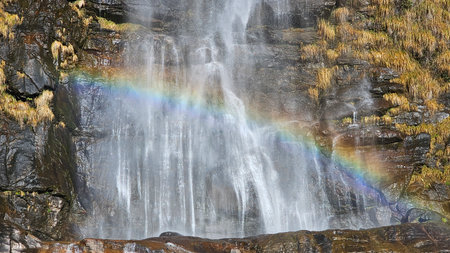 Borgonuovo di Piuro, SO, Italy - 10, 26, 2025. Aerial View of Acquafraggia Waterfalls with Rainbow in Valchiavenna, Italyのeditorial素材
