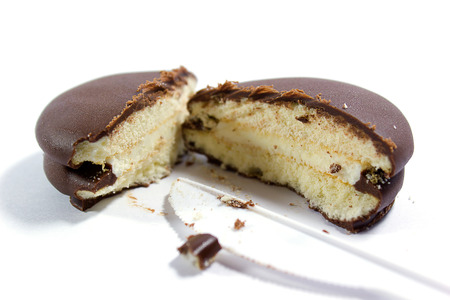 close up of a chocolate cream pie on white background.の写真素材