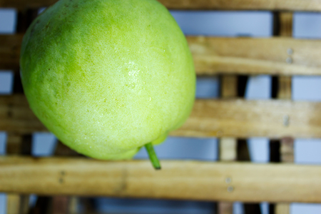 Fresh guava fruit on wood table : white backgroundの写真素材