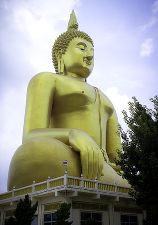 The big golden Buddha statue in Muang temple, Ang Thong, Thailand.の写真素材