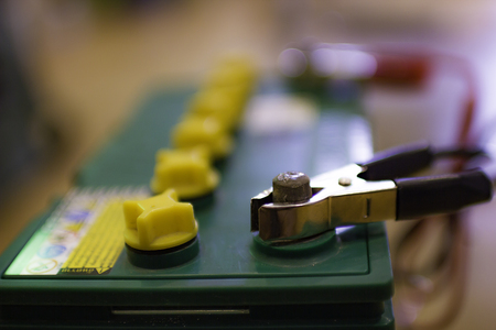 Negative electrode jumper cable charge on car batteryの写真素材