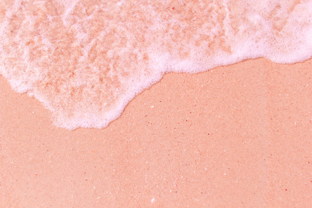 Soft wave with clear sand of sea on seashore.の写真素材
