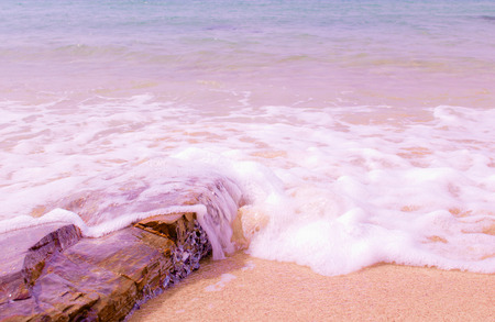 Rock on the beach and soft wave.の写真素材