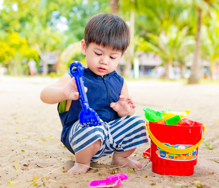 On Nov 04,2016. Little boy playing toy on the beach in Sai Kaew Beach, Thailand.のeditorial素材