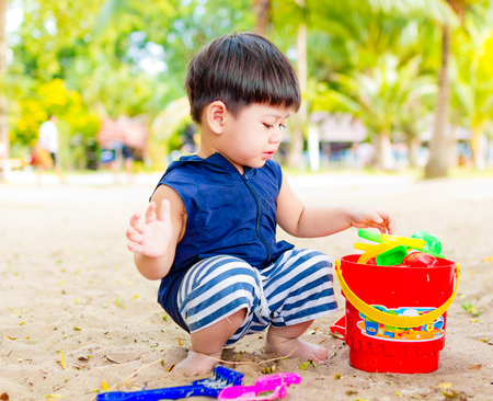On Nov 04,2016. Little boy playing toy on the beach in Sai Kaew Beach, Thailand.のeditorial素材