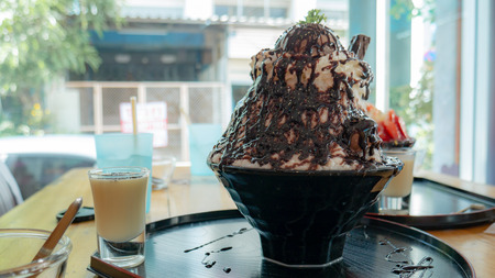 Close up bingsu with ice cream chocolate and whip-cream.の写真素材