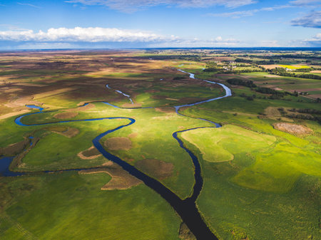 Aerial view of the river and meadows. Summer landscape in Latviaの写真素材