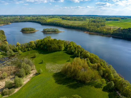 Aerial view of the river and forest in spring, Latvia.の写真素材