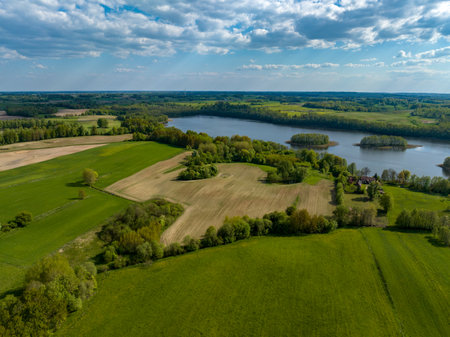 Aerial view of rural landscape with fields, forests and river.の写真素材