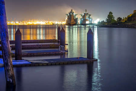 Ruston Park Boats from the docks in Washington state USA. The bay in Tacoma Washington at sunset and into nightfallのeditorial素材