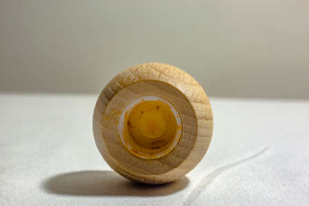 Wood cap for a bottle of hot sauce bottom. Wood cap shot very close up with a macro lensの写真素材
