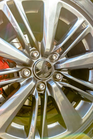 Chrome rims with no emblem and red break pad. Custom cars in Southern California summer 2017