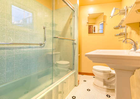 Small apartment bathroom with very nice upgraded ammenities. Wonderful real estate shoot of southern California home San Diego county. Edited to be bright, warm and cozyの写真素材