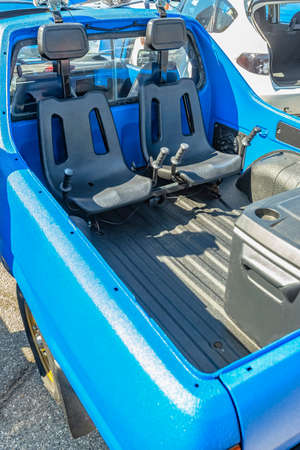 Dual seats in the back of a pickup truck for offroad use. Custom cars in Southern California summer 2017の写真素材