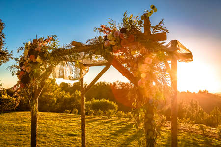 Jewish traditions wedding ceremony. Wedding canopy chuppah or huppah with lens flareの写真素材