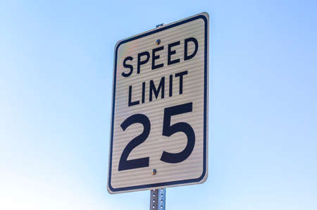 Speed limit sign viewed with a sky background