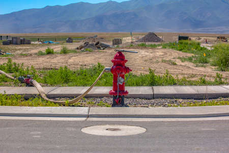Wrench and hose connected to hydrant