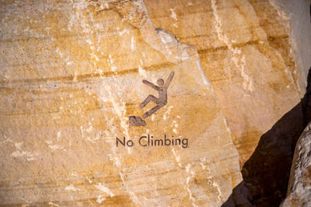No Climbing inscription on rocks in downtownの写真素材