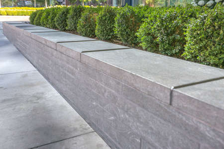 Metal gaurds on the edge of concrete planter