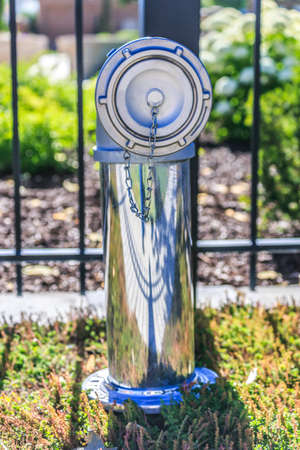 Reflective utility pipe with access from sidewalk