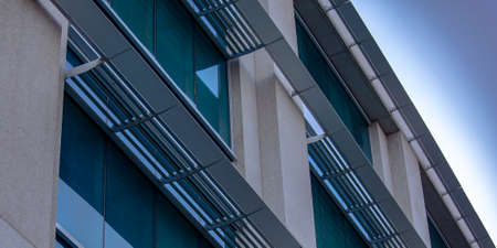 Modern building with glass windows at twilight