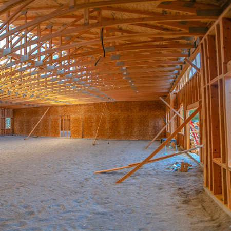 Construction yard, site, wooden beams and skeletal, scaffolding, framework structure of new...