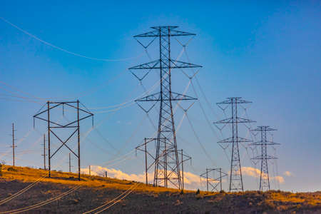 Electrical towers in the distance on the horizonの写真素材