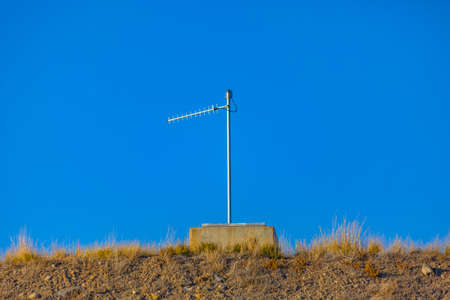 Radio antenna on the roof of a bunker in Utah