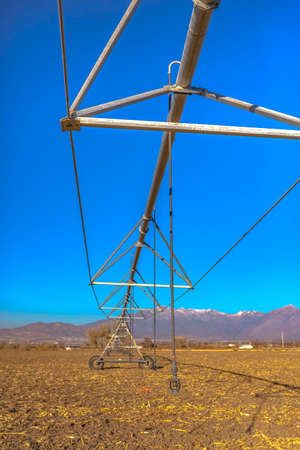 Center pivot irrigation system in empty field fall