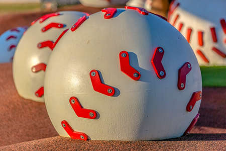 Close up of decorative baseballs on playground