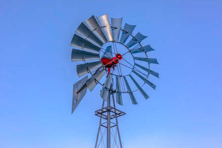 Looking up at aluminum windmill sky behind in Utah Valley. Saratoga Springs is a beautiful area right by Utah Lake. Lots of copy space on either side of the windmill.の写真素材