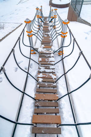 Bridge on a snow covered playground in Utahの写真素材