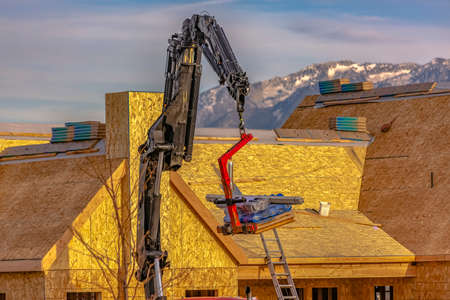 Crane and new homes against Mount Timpanogosの写真素材