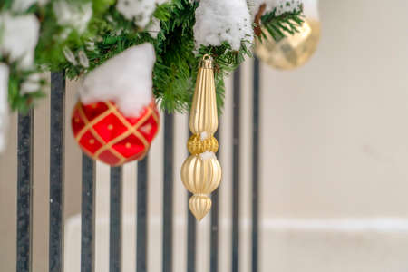 Christmas Garland with red and gold ornamentsの写真素材
