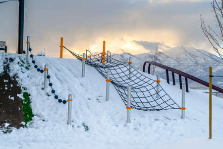 Climbing net on a snowy playground in Utahの写真素材