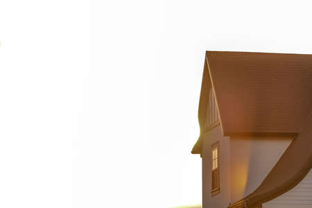 Close up of home exterior against bright skyの写真素材