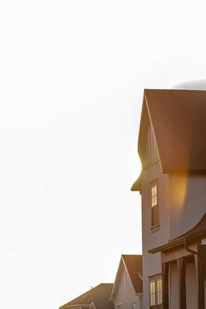Close up of home in Daybreak against bright skyの写真素材