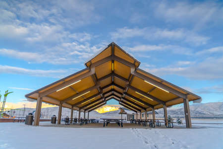 Eating area on a landscape with a blanket of snowの写真素材