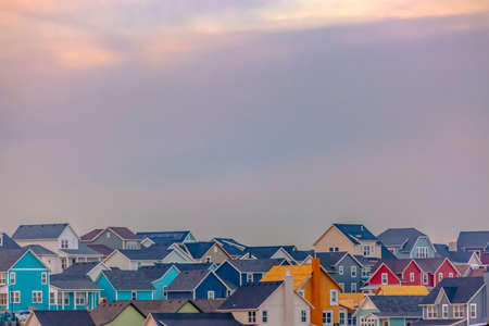 Colorful homes in Daybreak with sky in backgroundの写真素材