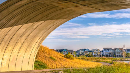 Pathway under an arched bridge in Oquirrh Lakeの写真素材